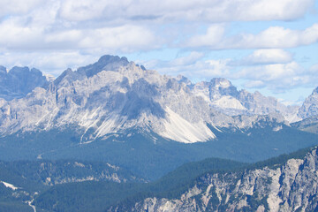 Majestic Dolomites mountains under beautiful cumoulus clouds