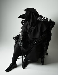 Gothic Plague Doctor with Lantern, Halloween Costume Character in Black Cloak, Bird Mask, sitting...