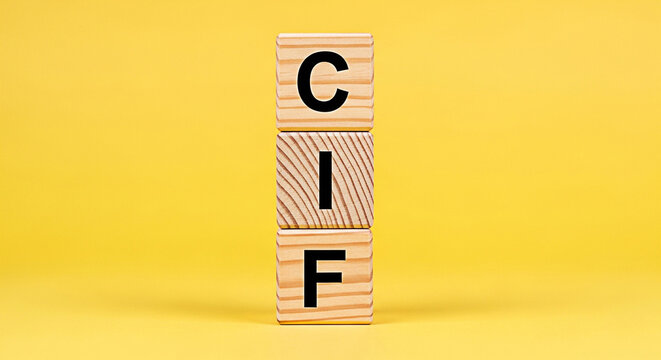Wooden blocks spelling cif stacked against a bright yellow background create a simple yet impactful visual for educational or business purposes