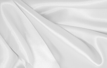Smooth elegant white silk or satin luxury cloth texture as wedding background. Luxurious background design