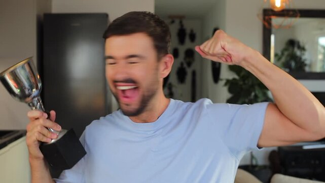 Proud man holding his trophy
