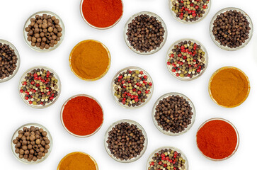 Flat lay composition with spices and seasonings in bowls on white. Site, content splash for cooking.