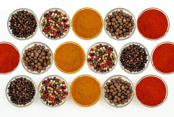 Flat lay composition with spices and seasonings in bowls on white. Site, content splash for cooking.