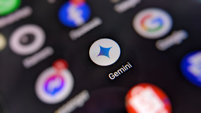 Selective focus of the Gemini AI Icon or Logo developed by Google on the smartphone screen display.