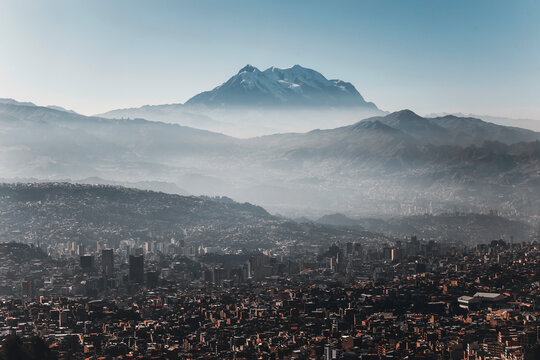 panorama of the city of la paz at sunrise with the illimani  mountain in the background