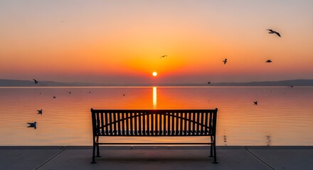 Peaceful sunset landscape with metal bench facing calm lake, flying birds in golden sky, beautiful evening reflection on water surface, tranquil nature scene for relaxation, serenity, and inspiration 