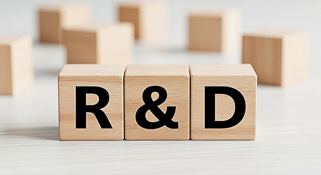 Wooden blocks spelling r and d representing research and development on a white surface for innovation and business concepts