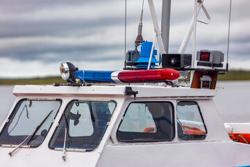 Close-up of red and blue flashing beacons on a rescue service vessel in Siberia, Russia