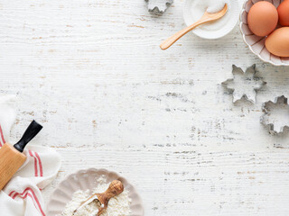 Culinary background with Ingredients for cooking Christmas baking on old white wooden background table. Top view. Christmas holiday kitchen background. Design element.
