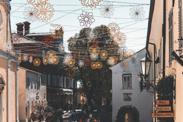 small square of the town in istria with flower shaped colorful festoons