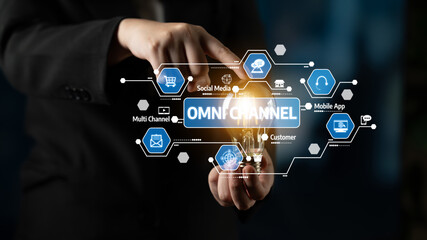 A business professional demonstrates an innovative omni-channel strategy by holding a light bulb among digital connection icons, highlighting customer engagement and interaction. Tessel