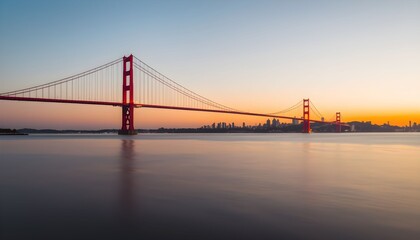 The iconic Golden Gate Bridge at sunrise, with the San Francisco skyline in the distance.