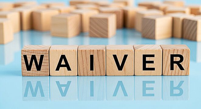 "Waiver" spelled out with wooden blocks on a blue surface represents legal agreements and contract negotiations for business and personal matters
