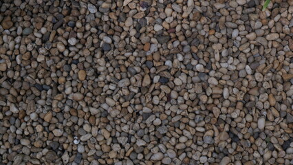 Surface of river pebbles on the ground