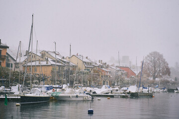 Winter landscape, small port at lake Geneva or lake Leman under the snow, image taken in Lutry,...