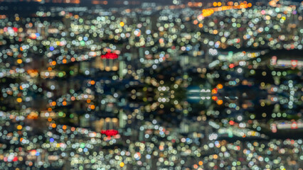 Abstract blurred bokeh background of city at night Bangkok Thailand