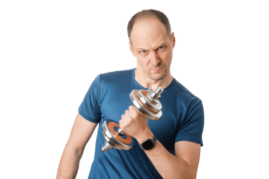 Strong man lifting dumbbell in workout session with focused expression in a fitness setting. He wears a blue shirt and appears focused on his fitness goals.