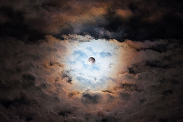 Cloudy Night with Red and Purple Tones During Lunar Eclipse