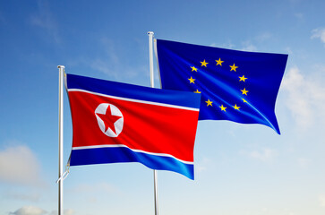 flags of European Union and north korea over blue sky background.