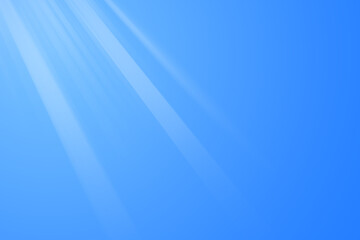 Sun in blue sky. Bright warm sun and lens flare in clear summer sky, sunlight with sunshine glare rays.
