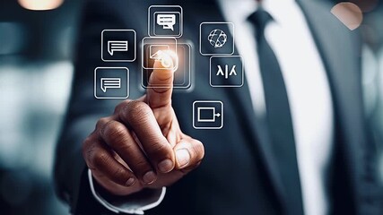 Close up of an african american businessman in a suit interacting with a futuristic digital interface, touching glowing icons for communication, business, and technology on a virtual screen - Powered by Adobe