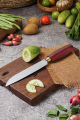 photo of a kitchen knife specifically for cutting vegetables and fruit, mirror and satin knife material