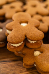 Making Festive Gingerbread Sandwiches on Rustic Wooden Table