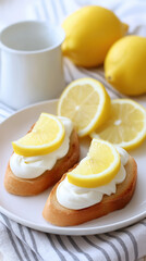 Lemon slice on cream cheese toast with fresh lemon and cup in background