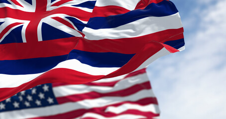 Hawaii state flag waving with the national flag of the United States of America