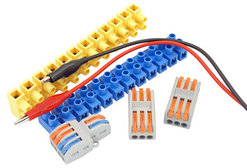 electrical terminal blocks and multimeter probes on white