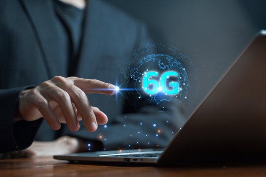 Futuristic businessman using 6G digital technology.
Smart connection and high-speed network concept.