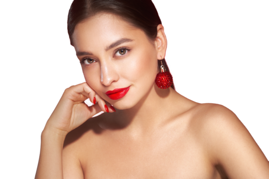 Portrait of beautiful young woman on transparent background, red lipstick and festive makeup, Christmas toy earrings, shiny glowing skin, Winter holidays concept