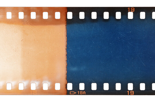 Dusty and grungy 35mm film texture or surface. Perforated scratched camera film isolated on white background.