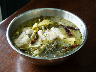 pickled mustard green soup with seabass