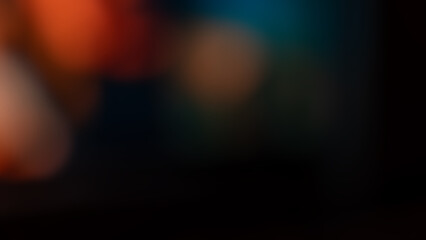 Soft blurred abstract background featuring a mix of warm orange and cool blue tones. Smooth gradient and defocused light create a moody atmosphere perfect for design, texture, or artistic projects. © Kateryna