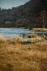 Acharacle, Scotland Highlands - River Shiel with clouds covering the mountains in the background on an overcast Autumn morning