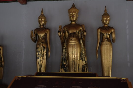 multiple gold statues of holy buddhist in wat pho, bangkok, thailand