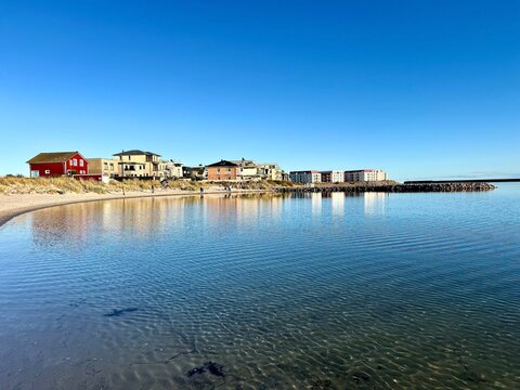 A photo of the tranquil Baltic Sea and the holiday village of Olpenitz, Germany - Powered by Adobe