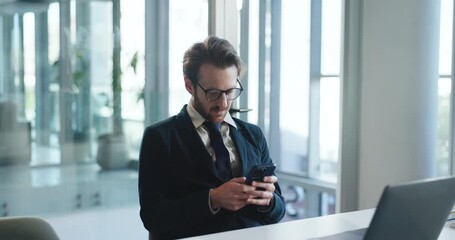 Phone, typing and businessman in office on break with networking, chatting or social media. Technology, research and male financial manager on cellphone for communication on mobile app in workplace. - Powered by Adobe