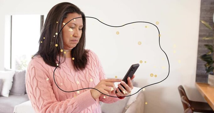 Mature woman tapping phone and seeing black border expanding as gold confetti swirl in technology