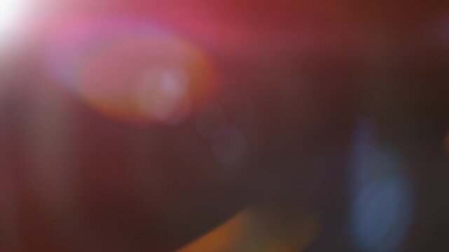 Slow motion of real lens flare through glass effects for overlay or transition - Powered by Adobe