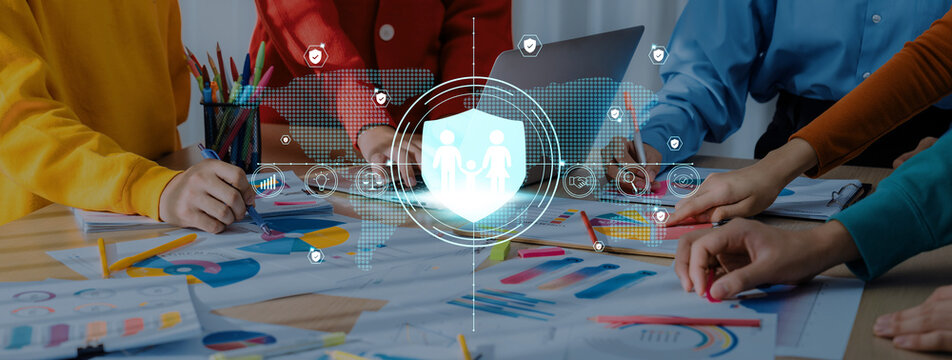 A diverse team engages in a collaborative discussion about data security strategies. The scene features charts and visual aids, emphasizing teamwork and digital protection. Trope