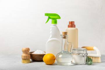 Eco cleaning.Cleaning products on a textured background. Eco-friendly home cleaning. A bottle of natural detergent surfaces, eco brushes, sponges, and rags. Cleaner concept.Cleaning supplies.Flat lay.