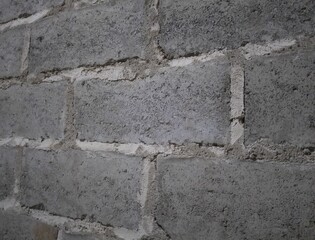 “Raw Concrete Block Wall Texture – Rough Gray Brick Background for Construction and Industrial Design”“A close-up view of a rough concrete block wall, showing the natural imperfections, rugged texture