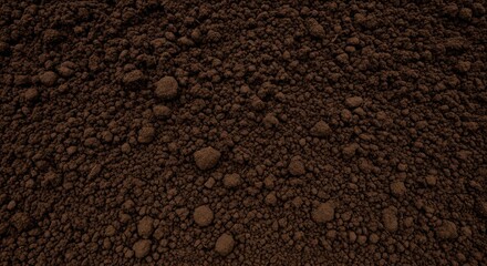 Rich dark brown soil texture with clumps for gardening and landscaping