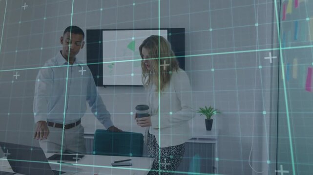Colleagues hovering above laptop trackpad in meeting room scrolling charts and reviewing metrics