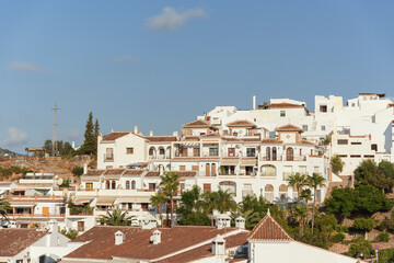 Panoramic View of Terraced Houses with Terracotta Roofs and Palm Trees, Costa del Sol, Andalucia.