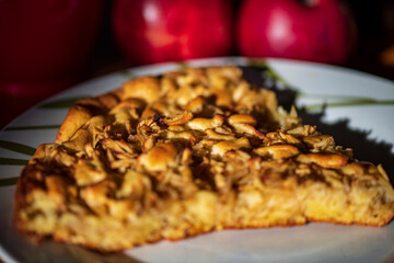 Baked apple pie, golden-brown and juicy, presented on a plate or table. The photo highlights the crispy crust, sweet apple filling, and the warm, homemade feel of this classic dessert.