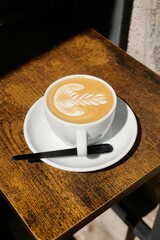 cup of coffee on wooden table