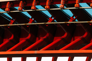Abstract architectural detail of red and blue steel structure